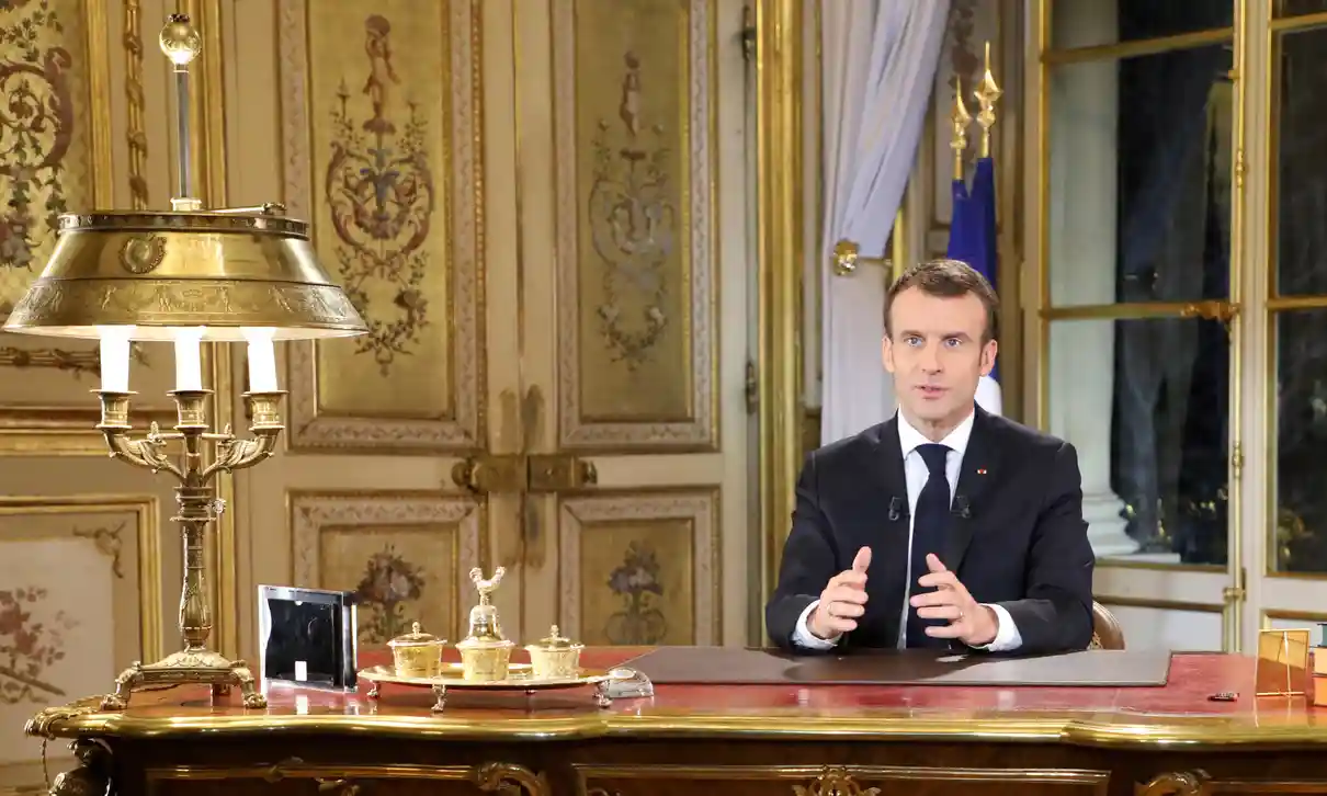 President Macron, golden desk